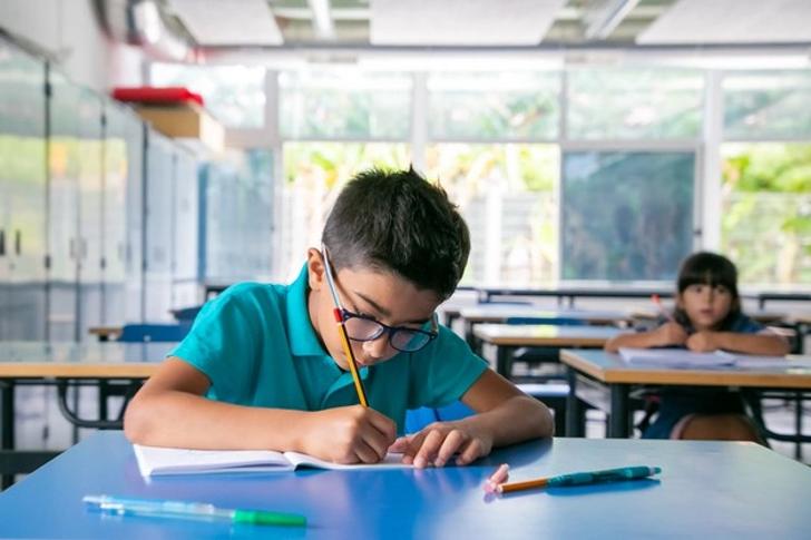 A student studying in class